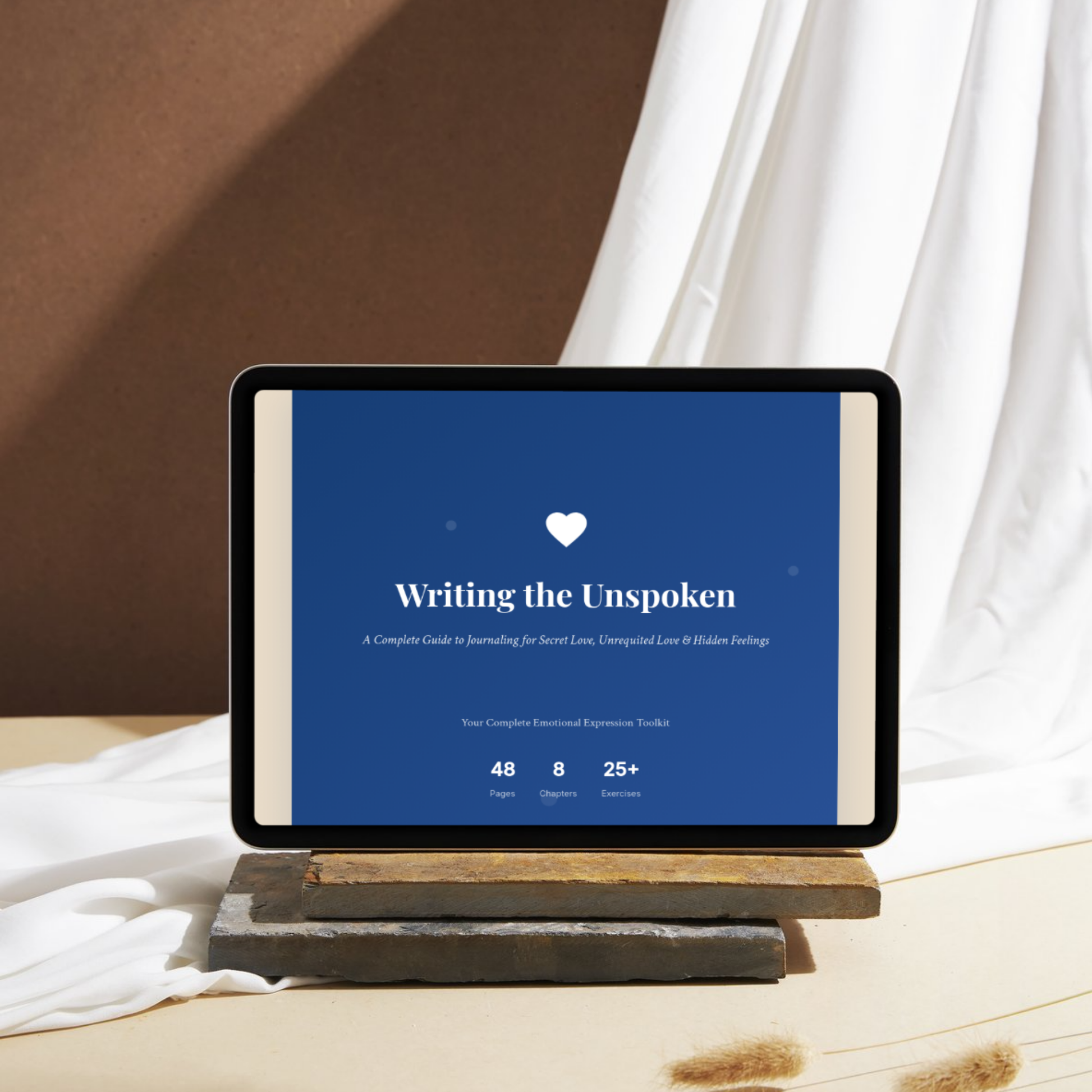 Tablet displaying the ‘Writing the Unspoken – Midnight Edition’ interactive eBook. Deep midnight blue cover with white heart icon, elegant serif typography, beige background, and highlights of 48 pages, 8 chapters, and 25+ reflection exercises. Guided journaling eBook for secret love, emotional clarity, and mindful self-reflection.