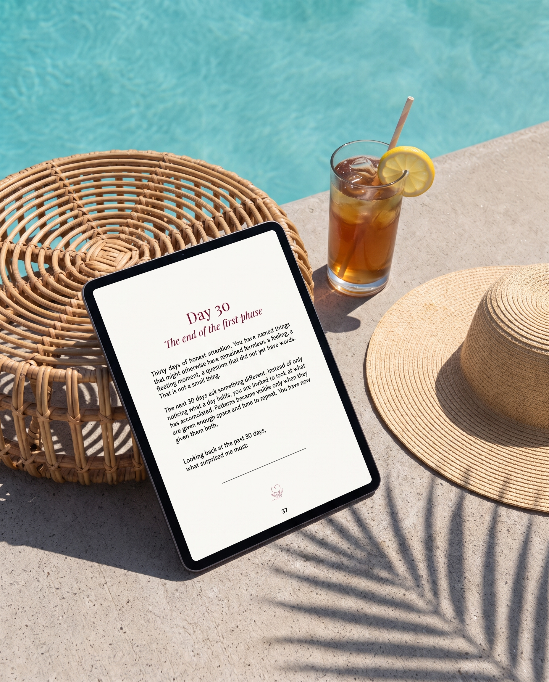 Day 30 milestone page of the Love in Secrecy Journal on iPad beside a rattan table and straw hat at the pool
